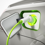 Plug-in hybrid or electric car being recharged. 3D illustration